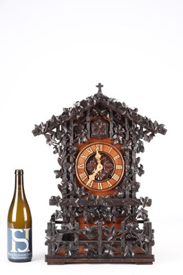Lot 95 - A GOOD 19TH CENTURY BLACK FOREST CARVED WALNUT DOUBLE FUSEE CUCKOO CLOCK
