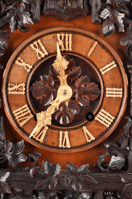 Lot 95 - A GOOD 19TH CENTURY BLACK FOREST CARVED WALNUT DOUBLE FUSEE CUCKOO CLOCK