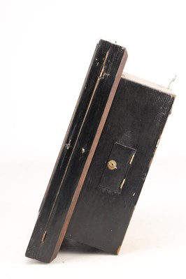 Lot 21 - A 19TH CENTURY BLACK FOREST GERMAN AUTOMATON WALL CLOCK WITH ROCKING EYES