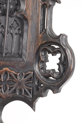 Lot 60 - AN UNUSUAL 19TH CENTURY AND LATER CARVED OAK BLACK FOREST FLUTE PLAYER CUCKOO CLOCK