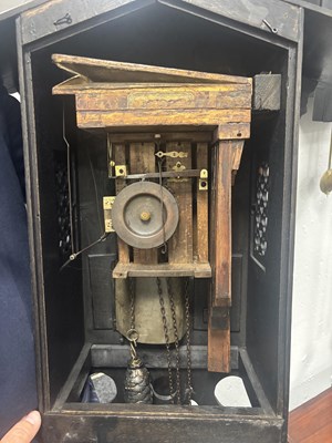 Lot 60 - AN UNUSUAL 19TH CENTURY AND LATER CARVED OAK BLACK FOREST FLUTE PLAYER CUCKOO CLOCK