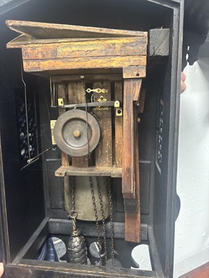 Lot 60 - AN UNUSUAL 19TH CENTURY AND LATER CARVED OAK BLACK FOREST FLUTE PLAYER CUCKOO CLOCK