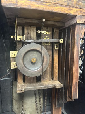 Lot 60 - AN UNUSUAL 19TH CENTURY AND LATER CARVED OAK BLACK FOREST FLUTE PLAYER CUCKOO CLOCK