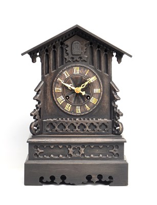 Lot A 19TH CENTURY BLACK FOREST CARVED LINDEN WOOD CUCKOO CLOCK