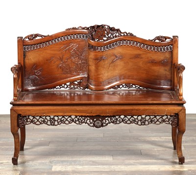 Lot A LATE 19TH CENTURY CHINESE CARVED HARDWOOD TWO-SEATER BENCH