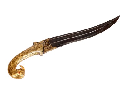 Lot A 19TH CENTURY INDIAN GOLD OVERLAID IRON PARROT'S HEAD-HILTED DAGGER