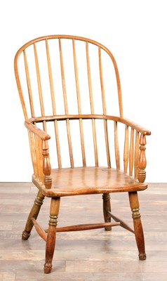 Lot AN 18TH CENTURY ASH AND ELM STICK-BACK WINDSOR ARMCHAIR
