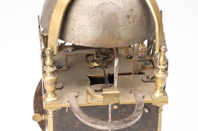 Lot 77 - NICHOLAS COXETER, LONDINI. A MID 17TH CENTURY BRASS VERGE LANTERN CLOCK