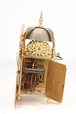 Lot 65 - GEORGE CLARKE, LONDON. AN EARLY 18TH CENTURY BRASS ARCHED DIAL LANTERN CLOCK