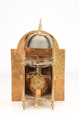 Lot 65 - GEORGE CLARKE, LONDON. AN EARLY 18TH CENTURY BRASS ARCHED DIAL LANTERN CLOCK