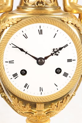 Lot 70 - AN EARLY 19TH CENTURY FRENCH ORMOLU URN-FORM MANTEL CLOCK WITH PUTTI MOUNTS