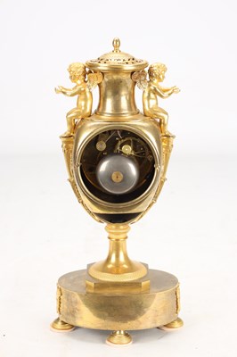 Lot 70 - AN EARLY 19TH CENTURY FRENCH ORMOLU URN-FORM MANTEL CLOCK WITH PUTTI MOUNTS