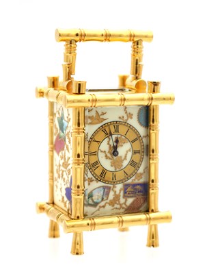 Lot 23 - A LATE 19TH CENTURY FRENCH MINIATURE GILT BRASS AND PORCELAIN PANELLED CARRIAGE CLOCK