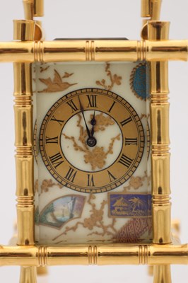 Lot 23 - A LATE 19TH CENTURY FRENCH MINIATURE GILT BRASS AND PORCELAIN PANELLED CARRIAGE CLOCK