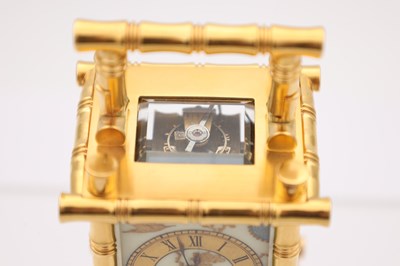 Lot 23 - A LATE 19TH CENTURY FRENCH MINIATURE GILT BRASS AND PORCELAIN PANELLED CARRIAGE CLOCK