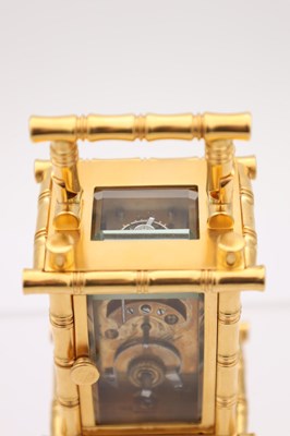 Lot 23 - A LATE 19TH CENTURY FRENCH MINIATURE GILT BRASS AND PORCELAIN PANELLED CARRIAGE CLOCK