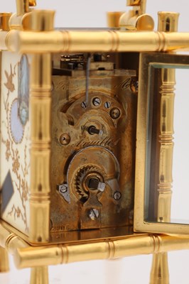 Lot 23 - A LATE 19TH CENTURY FRENCH MINIATURE GILT BRASS AND PORCELAIN PANELLED CARRIAGE CLOCK