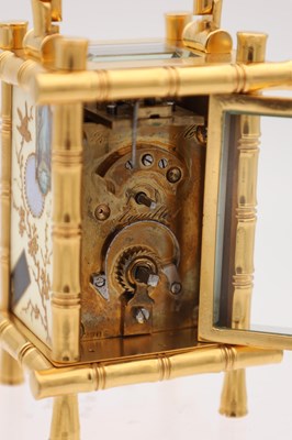Lot 23 - A LATE 19TH CENTURY FRENCH MINIATURE GILT BRASS AND PORCELAIN PANELLED CARRIAGE CLOCK