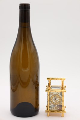 Lot 23 - A LATE 19TH CENTURY FRENCH MINIATURE GILT BRASS AND PORCELAIN PANELLED CARRIAGE CLOCK