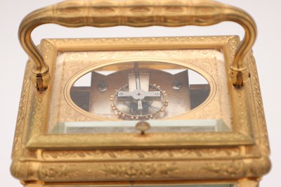 Lot 38 - DROCOURT, PARIS. A RARE LATE 19TH CENTURY GIANT GILT ENGRAVED GORGE CASED REPEATING CARRIAGE CLOCK WITH PORCELAIN PANELS