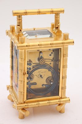 Lot 57 - HENRI JACOT A LATE 19TH CENTURY FRENCH GILT BRASS BRONZE AND MIXED METAL REPEATING CARRIAGE CLOCK
