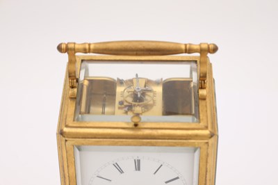 Lot 191 - RAINGO A PARIS A MID-19TH CENTURY GILT ONE-PIECE CASE GRAND SONNERIE CARRIAGE CLOCK