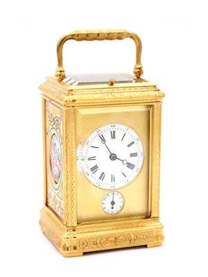 Lot 35 - A LATE 19TH CENTURY FRENCH GILT ENGRAVED ENAMEL AND PORCELAIN REPEATING CARRIAGE CLOCK