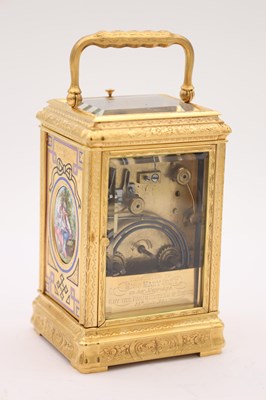 Lot 35 - A LATE 19TH CENTURY FRENCH GILT ENGRAVED ENAMEL AND PORCELAIN REPEATING CARRIAGE CLOCK