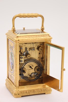 Lot 35 - A LATE 19TH CENTURY FRENCH GILT ENGRAVED ENAMEL AND PORCELAIN REPEATING CARRIAGE CLOCK