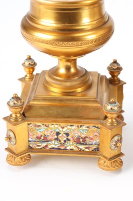 Lot 74 - A GOOD QUALITY LATE 19TH CENTURY FRENCH GILT CASED CHAMPLEVE ENAMEL AND PORCELAIN PANELLED CLOCK GARNITURE