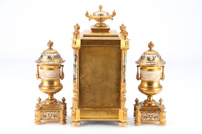 Lot 74 - A GOOD QUALITY LATE 19TH CENTURY FRENCH GILT CASED CHAMPLEVE ENAMEL AND PORCELAIN PANELLED CLOCK GARNITURE