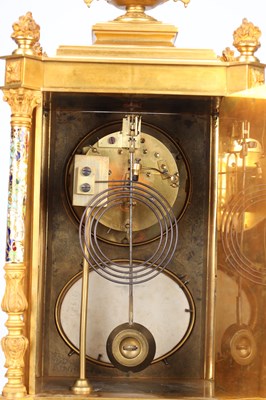 Lot 74 - A GOOD QUALITY LATE 19TH CENTURY FRENCH GILT CASED CHAMPLEVE ENAMEL AND PORCELAIN PANELLED CLOCK GARNITURE
