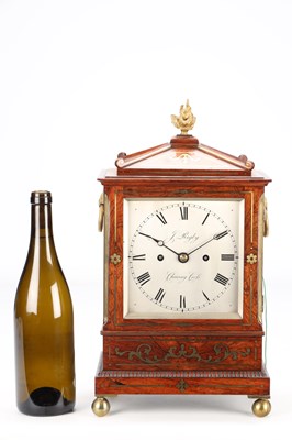 Lot 52 - JAMES RIGBY, CHARING CROSS. A SMALL REGENCY BRASS INLAID ROSEWOOD STRIKING BRACKET CLOCK
