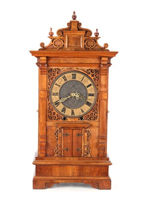 Lot 156 - A MID 19TH CENTURY BLACK FOREST WALNUT TRUMPETER CLOCK
