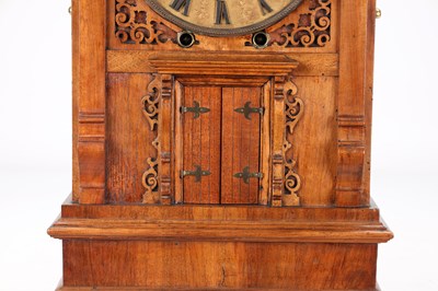 Lot 156 - A MID 19TH CENTURY BLACK FOREST WALNUT TRUMPETER CLOCK