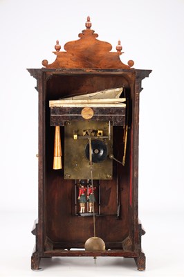 Lot 156 - A MID 19TH CENTURY BLACK FOREST WALNUT TRUMPETER CLOCK