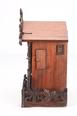 Lot 4 - A LATE 19TH CENTURY BLACK FOREST CARVED WOOD CUCKOO CLOCK