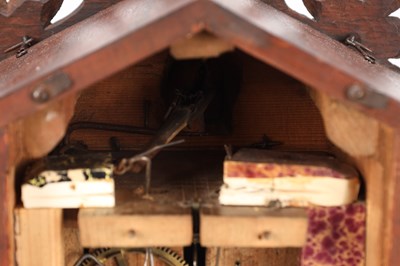 Lot 4 - A LATE 19TH CENTURY BLACK FOREST CARVED WOOD CUCKOO CLOCK