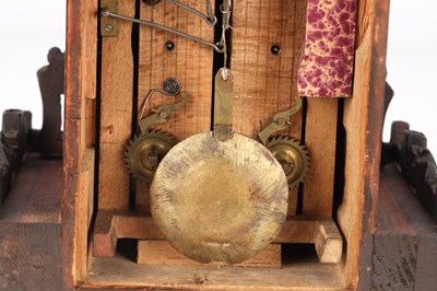 Lot 4 - A LATE 19TH CENTURY BLACK FOREST CARVED WOOD CUCKOO CLOCK