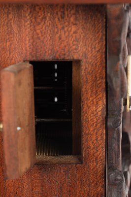 Lot 4 - A LATE 19TH CENTURY BLACK FOREST CARVED WOOD CUCKOO CLOCK