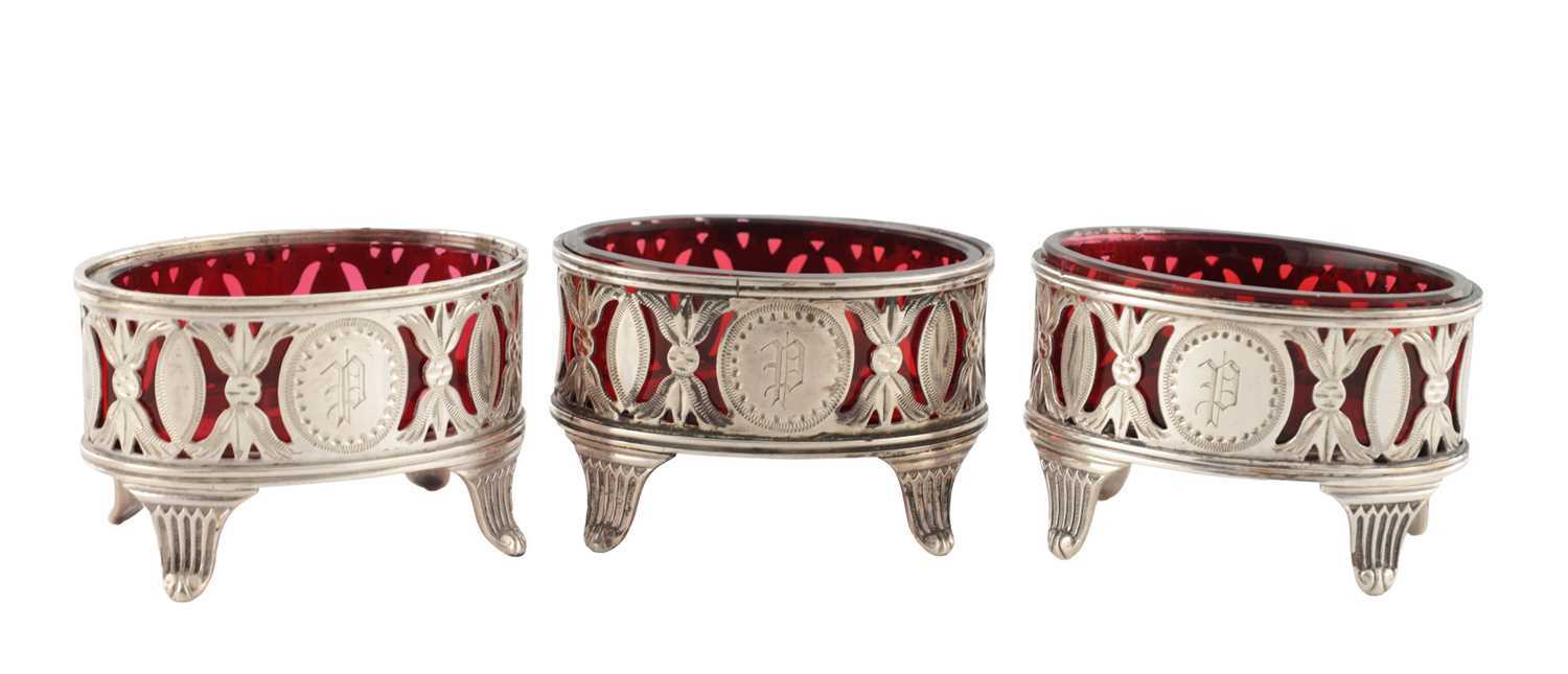 Lot A SET OF THREE LATE 19TH CENTURY SILVER TABLE SALTS