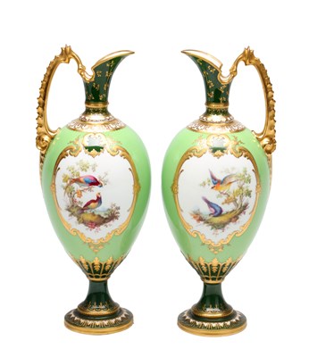 Lot GEORGE DARLINGTON A FINE PAIR OF EARLY 20TH CENTURY CROWN DERBY PORCELAIN EWERS