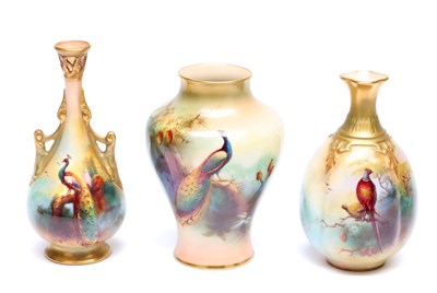 Lot A COLLECTION OF THREE 19TH CENTURY ROYAL WORCESTER VASES HAND PAINTED WITH PEACOCKS BY F.J. BRAY
