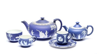 Lot A COLLECTION OF LATE 19TH CENTURY BLUE AND WHITE PORCELAIN TEAPOTS AND CUPS