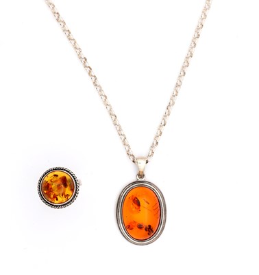 Lot A COGNAC BALTIC AMBER AND SILVER RING AND PENDANT NECKLACE