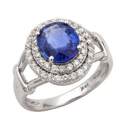 Lot A SAPPHIRE AND DIAMOND 18CT WHITE GOLD HALO RING