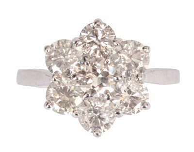 Lot 288 - A LADIES 18CT WHITE GOLD SEVEN STONE DIAMOND...