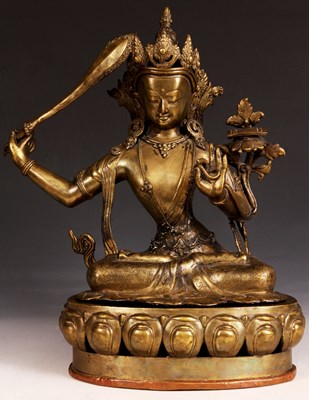 Lot 142 - An Eastern Cast Brass FIGURE of a BUDDHA on an...