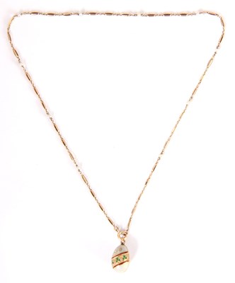 Lot 280 - A 9K GOLD ENAMELLED RUSSIAN EGG PENDANT on...