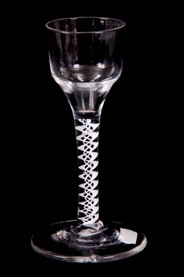 Lot 3 - AN 18TH CENTURY CORDIAL GLASS with ogee bowl...